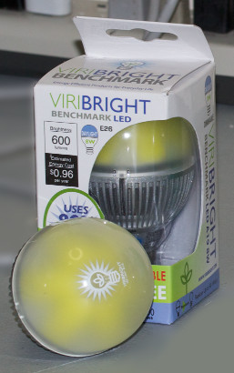An LED light bulb is depicted next to another one in the box.